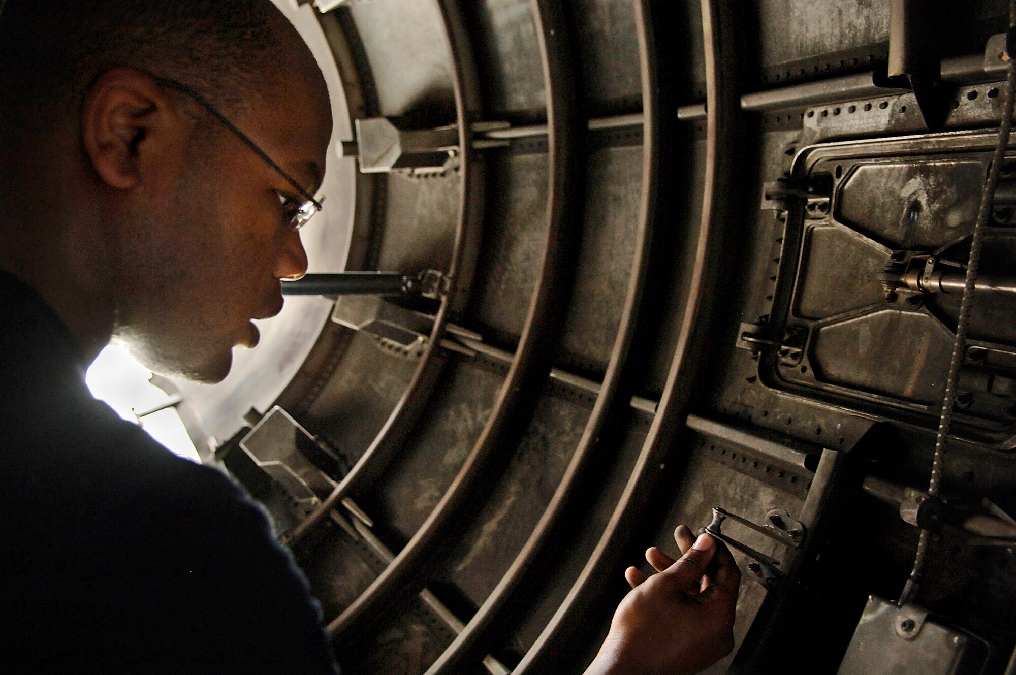 Airmen 1st Class Reginold Camp conducts part of a home station check inspection by going over a C-17 Globemaster III engine checklist Aug. 9 at Charleston Air Force Base, S.C. Airman Camp is a jet engine technician assigned to the 437th Maintenance Squadron. (U.S. Air Force photo/Airman 1st Class Nicholas Pilch)