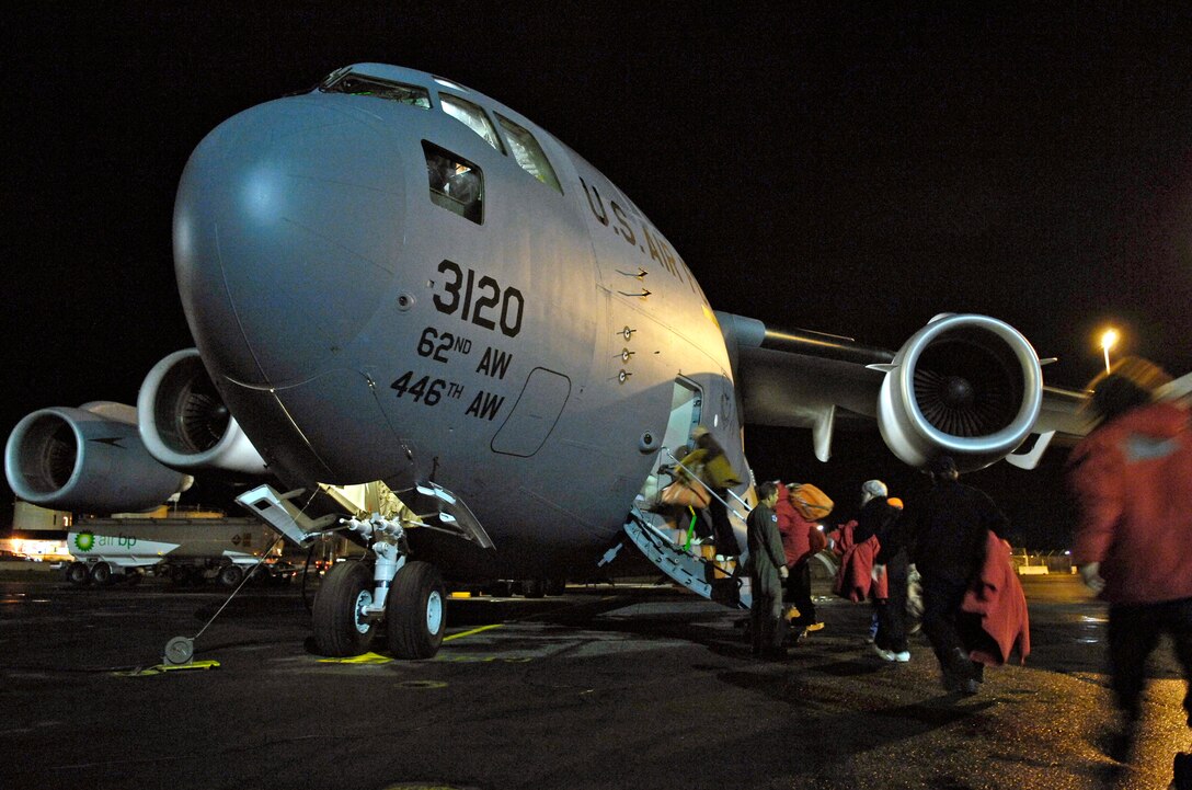 Members of the National Science Foundation load on to a C-17 Globemaster III for a winter fly-in mission for Operation Deep Freeze Aug. 20 at Christchurch, New Zealand. A C-17 Globemaster III and 31 Airmen from McChord Air Force Base, Wash., are flying in an augmentation of scientists, support staff, food and equipment for the U.S. Antarctic Program at McMurdo Station. (U.S. Air Force photo/Tech. Sgt. Shane A. Cuomo) 