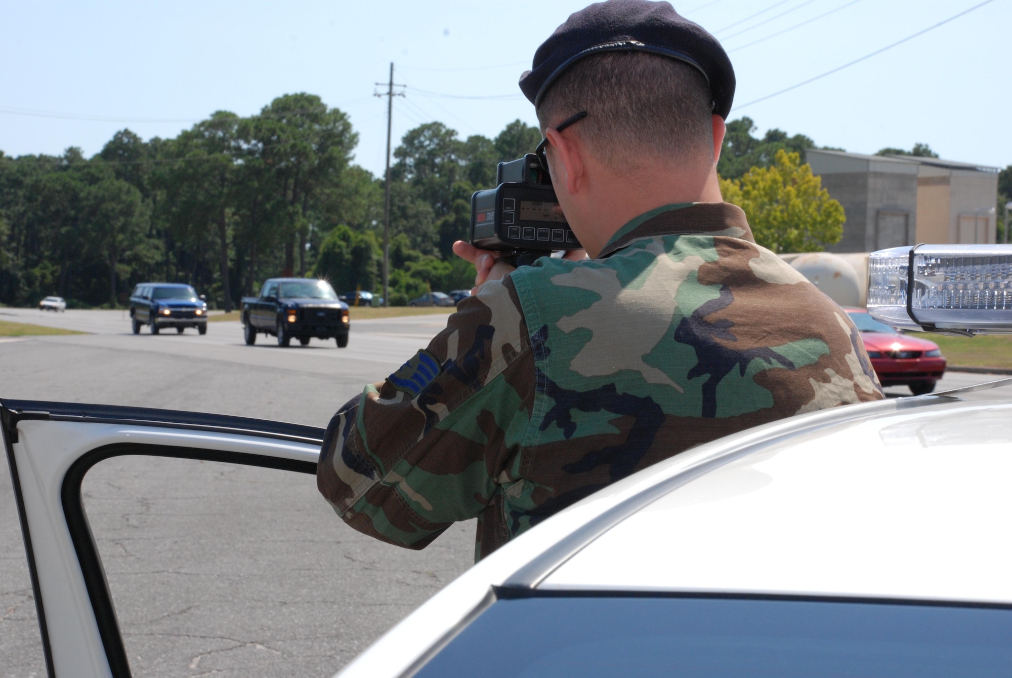 EGLIN AIR FORCE BASE, Fla. -- Staff Sgt. Robert McMenamin, 96th Security Forces, monitors speed on Eglin Boulevard. An administrative driving suspension policy goes into effect Sept. 1. (USAF photo by Staff Sgt. Mike Meares)