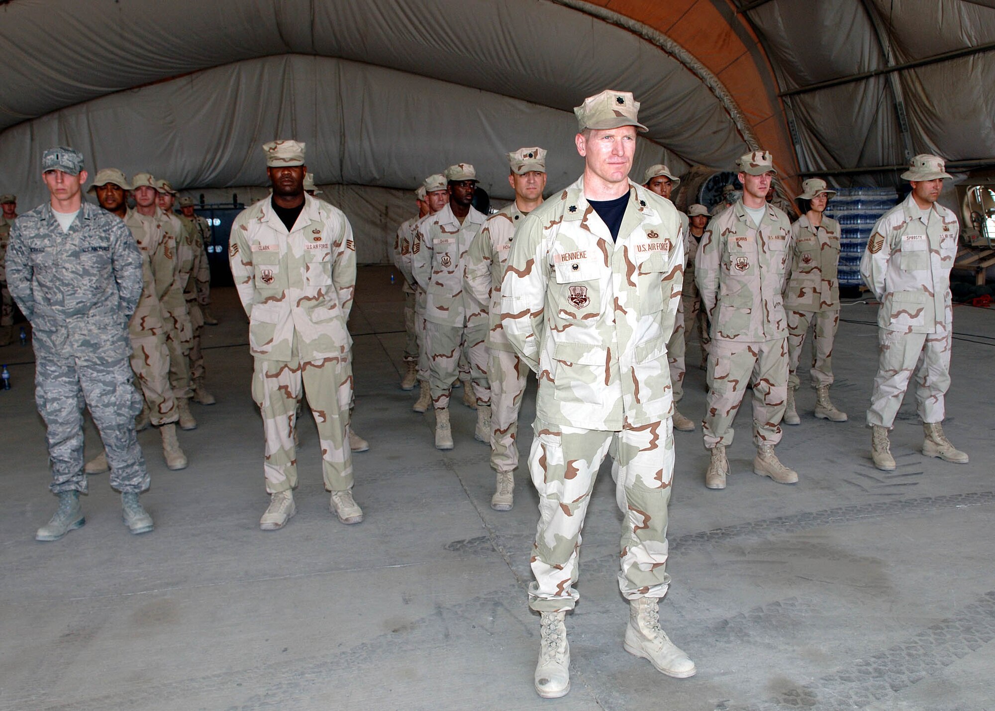 Lt. Col. Mark Henneke, 755th Air Expeditionary Group vice commander, commands a flight of 755th AEG Airmen at the group's change of command ceremony August 21 at Bagram Airfield, Afghanistan. Col. Henneke was replaced by Lt. Col. Marc Piccolo as the group's vice commander. (U.S. Air Force photo by Staff Sgt. Craig Seals)