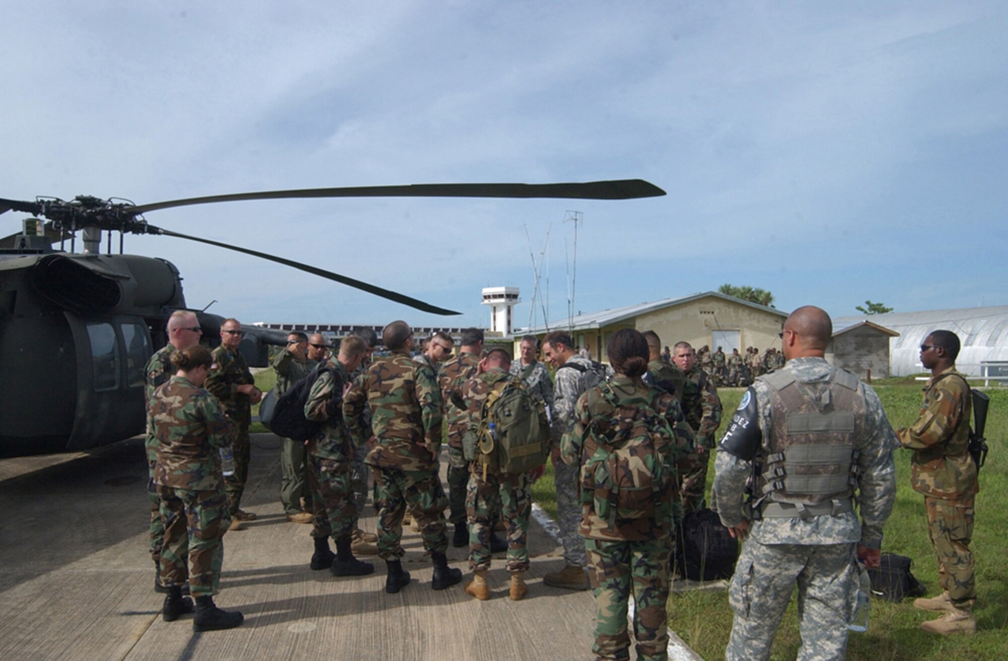 BELIZE CITY, Belize - Approximately 20 Soldiers and Airmen from Soto Cano Air Base, Honduras, deployed here as part of an initial assessment team following Hurricane Dean Aug 21. The team members were transported via two UH-60 Black Hawk and one CH-47 Chinook helicopter. The team is comprised of a security detail, medics, engineers, search and rescue assets and communications specialists.    (U.S. Air Force photo by Tech. Sgt. Sonny Cohrs)                               