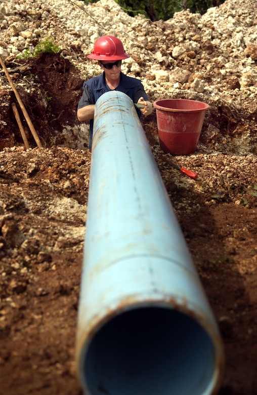 ANDERSEN AIR FORCE BASE, Guam - Airman 1st Class Christopher Jewett, 554th RED HORSE Squadron, files the end of a pipe at Northwest Field, Aug. 22, 2007.  The 554th RED HORSE Squadron is currently building new infrastructure on Northwest Field. (Photo by Senior Airman Miranda Moorer/36th Wing Public Affairs)          