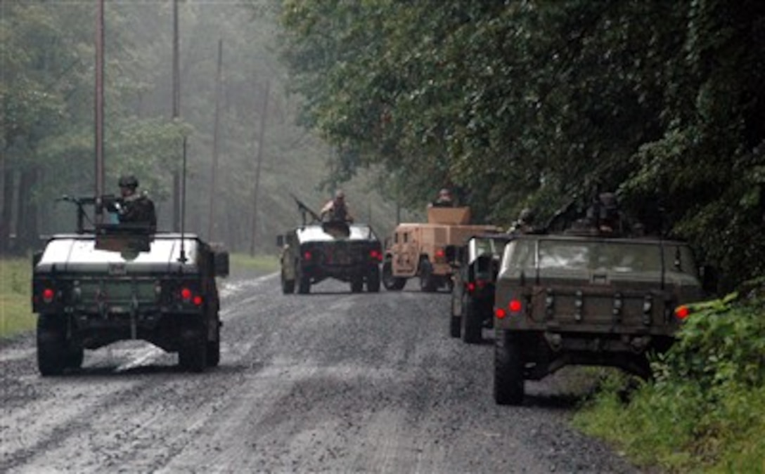 U.S. Air Force airmen in the Phoenix Warrior Training Course 07-6 practice conducting a convoy checkpoint during training Aug. 21, 2007, on a range at Fort Dix, N.J. The course focuses on contingency skills for Air Force security forces and is taught by the U.S. Air Force Expeditionary Center's 421st Combat Training Squadron.