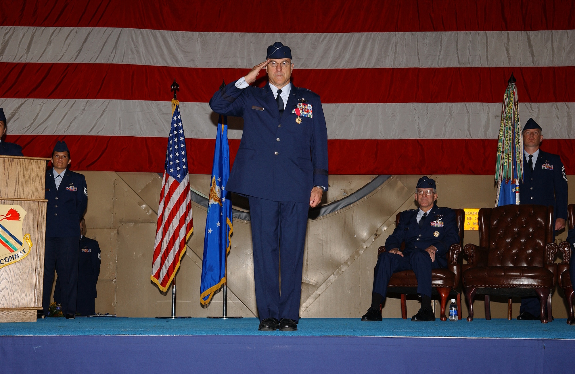 EIELSON AIR FORCE BASE, Alaska -- Brig. Gen. Dave Scott presents one last final salute to the Iceman Team as the acting 354th Fighter Wing commander Aug. 22 at the Thunderdome. Lt. Gen. Fraser passed the guidon from Brig. Gen. Dave Scott to Brig. Gen. Mark Graper. (U.S. Air Force Photo by Airman 1st Class Jonathan Snyder)(Released)