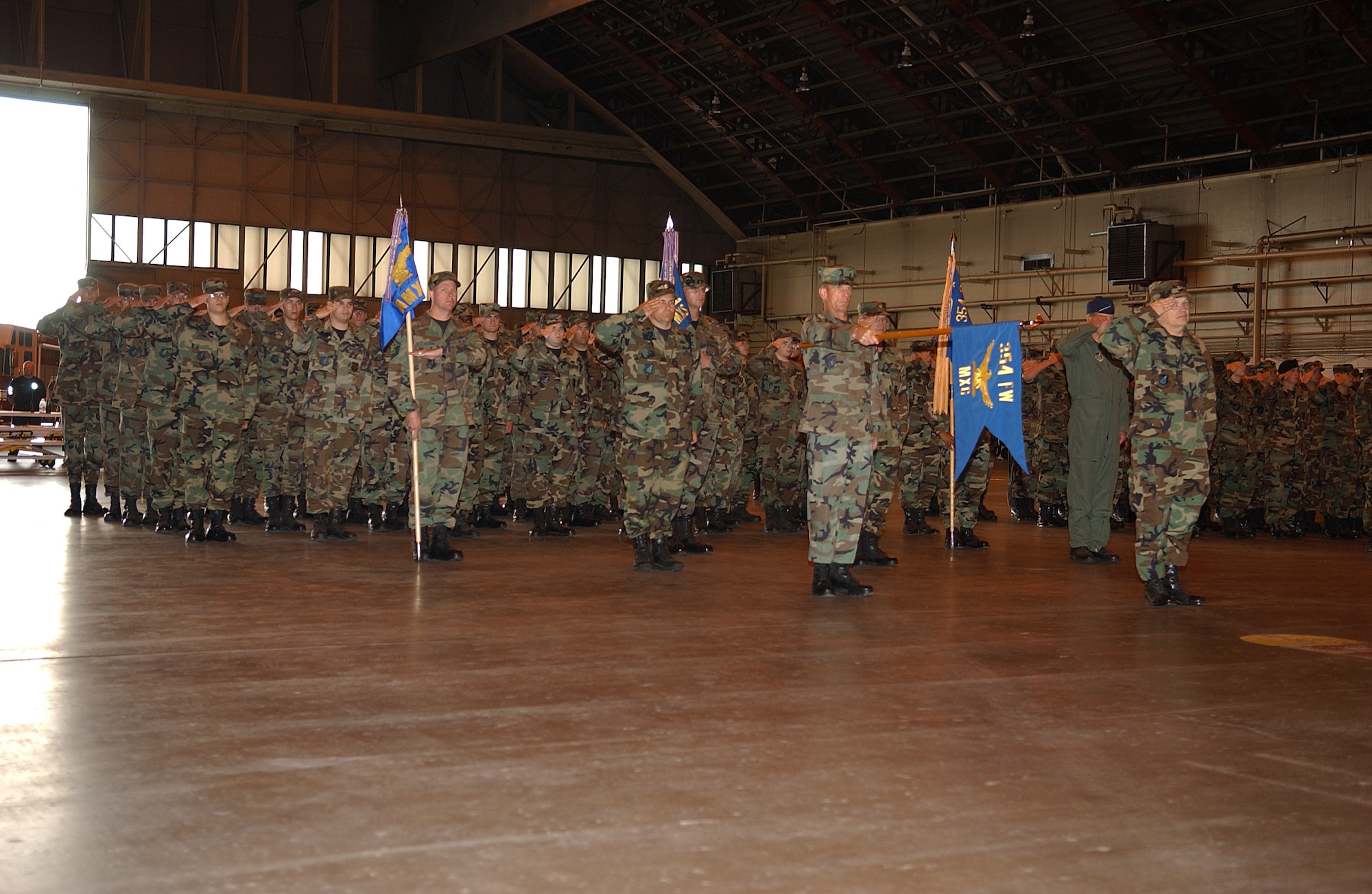 EIELSON AIR FORCE BASE, Alaska -- The Iceman Team render one last salute for Brig. Gen. Dave Scott before he relinquishes command Aug. 22 at the Thunderdome. Lt. Gen.l Fraser, 11th Air Force commander passed the guidon from Brig. Gen. David Scott to Brig. Gen. Mark Graper. (U.S. Air Force Photo by Airman 1st Class Jonathan Snyder)(Released)