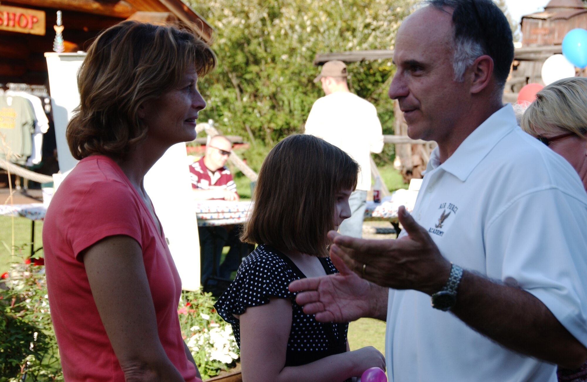 EIELSON AIR FORCE BASE, Alaska -- Brig. Gen. Dave Scott (right), 354th Fighter Wing commander, speaks with Senator Lisa Murkowski (left) of Alaska, during Red, White and Blue Garden Party Aug. 18. Pioneer Park held its annual Military Appreciation Day with free food, activities, and live bands throughout the day. (U.S. Air Force Photo by Airman 1st Class Jonathan Snyder)(Released)