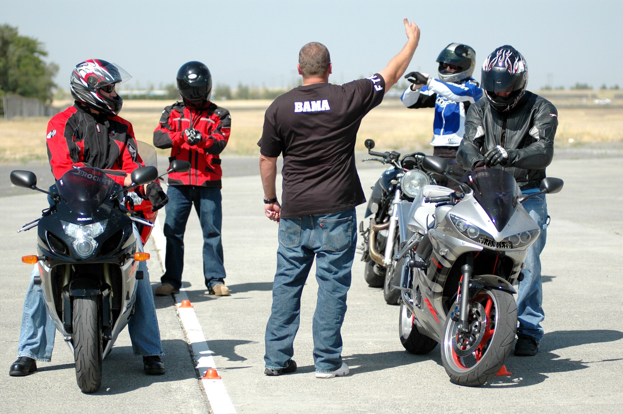 FAIRCHILD AIR FORCE BASE, Wash. – Staff Sgt. Robert Simpson, 92nd Civil Engineering squadron, is giving instructions to students of the U.S. Air Force Sport Bike Training class Aug. 16. The class teaches fundamentals of riding sport bikes, prepares the riders to handle certain situations that may occur on the road and allows them to become more familiar with their bikes. The next class will be held Sept. 6. (U.S. Air Force photo / Tech. Sgt. Larry W. Carpenter Jr.)
