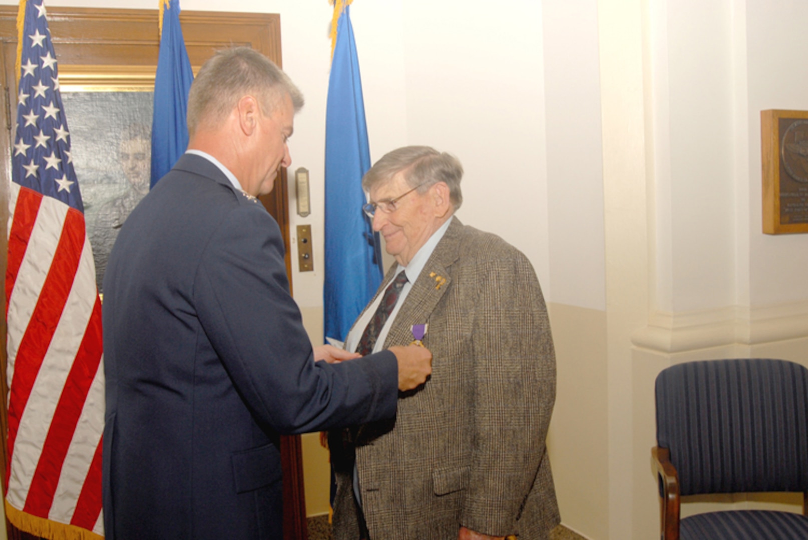 Maj. Gen. Anthony Przybyslawski, Air Force Personnel Center commander, presents the Purple Heart to Roy Talbott, 84, a World War II veteran who served as a B-24 gunner with the 72nd Bomb Squadron in the Pacific Theater. (Photo by Steve White)