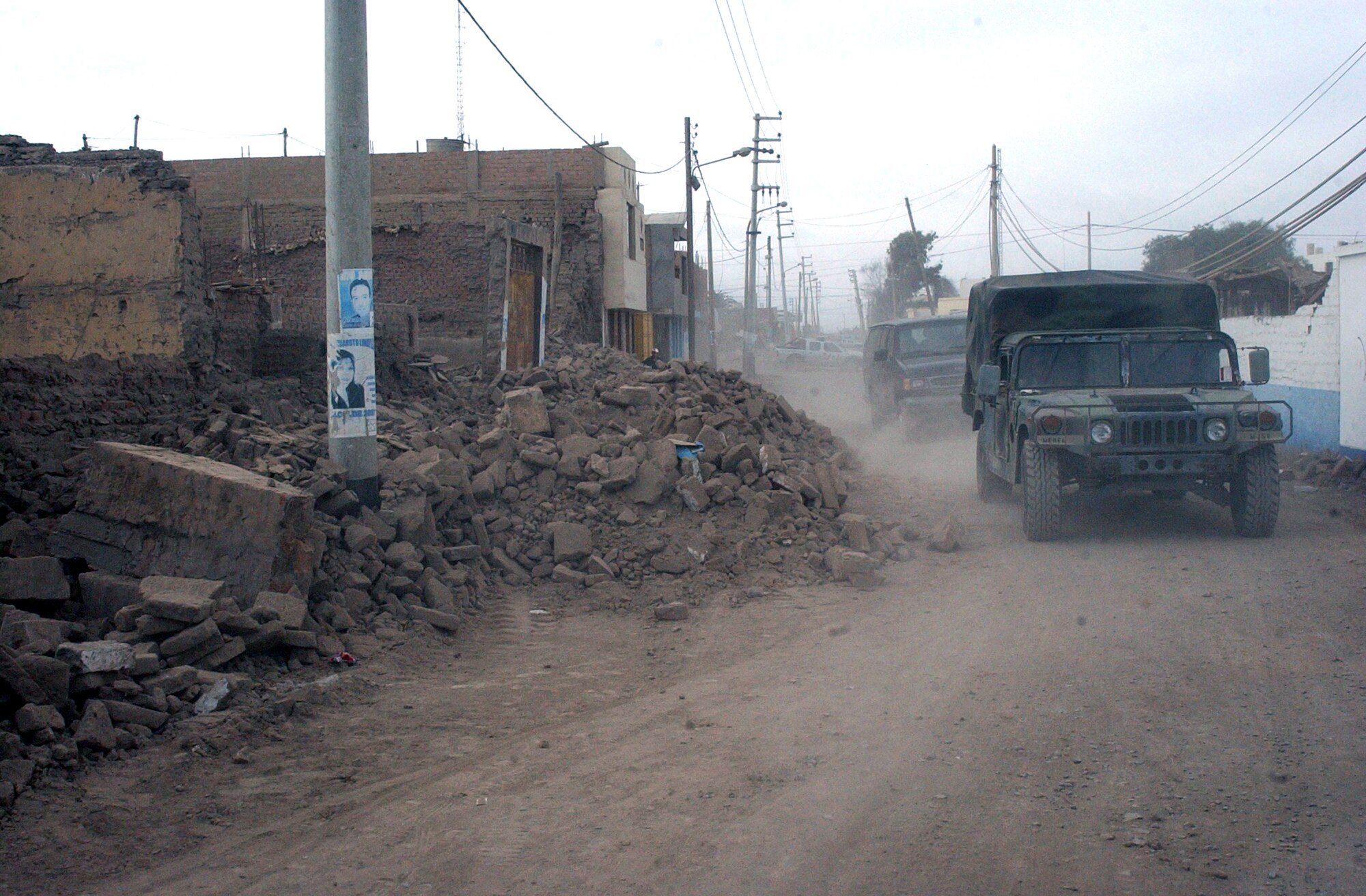 Joint Task Force-Bravo's medical humanitarian relief task force members make their way throught the streets of Pisco, Peru, Aug. 21. The task force set up a pharmacy in the town, and doctors treated patients for ailments such as gastro-intestinal illness and respiratory infections. The task force treated more than 1,500 people during their deployment to Peru, following the 8.0 magnitude earthquake that struck the region Aug. 15. (U.S. Air Force photo/Senior Airman Shaun Emery) 