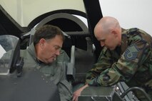 Utah's Lieutenant Governor, Gary Herbert, steps through egress training with Master Sgt. Dale Ludwig of the 388th Operations Support Squadron.  Lt. Gov. Herbert visited Hill AFB Aug. 17 to experience the wing's mission and people firsthand during an F-16 orientation flight.
