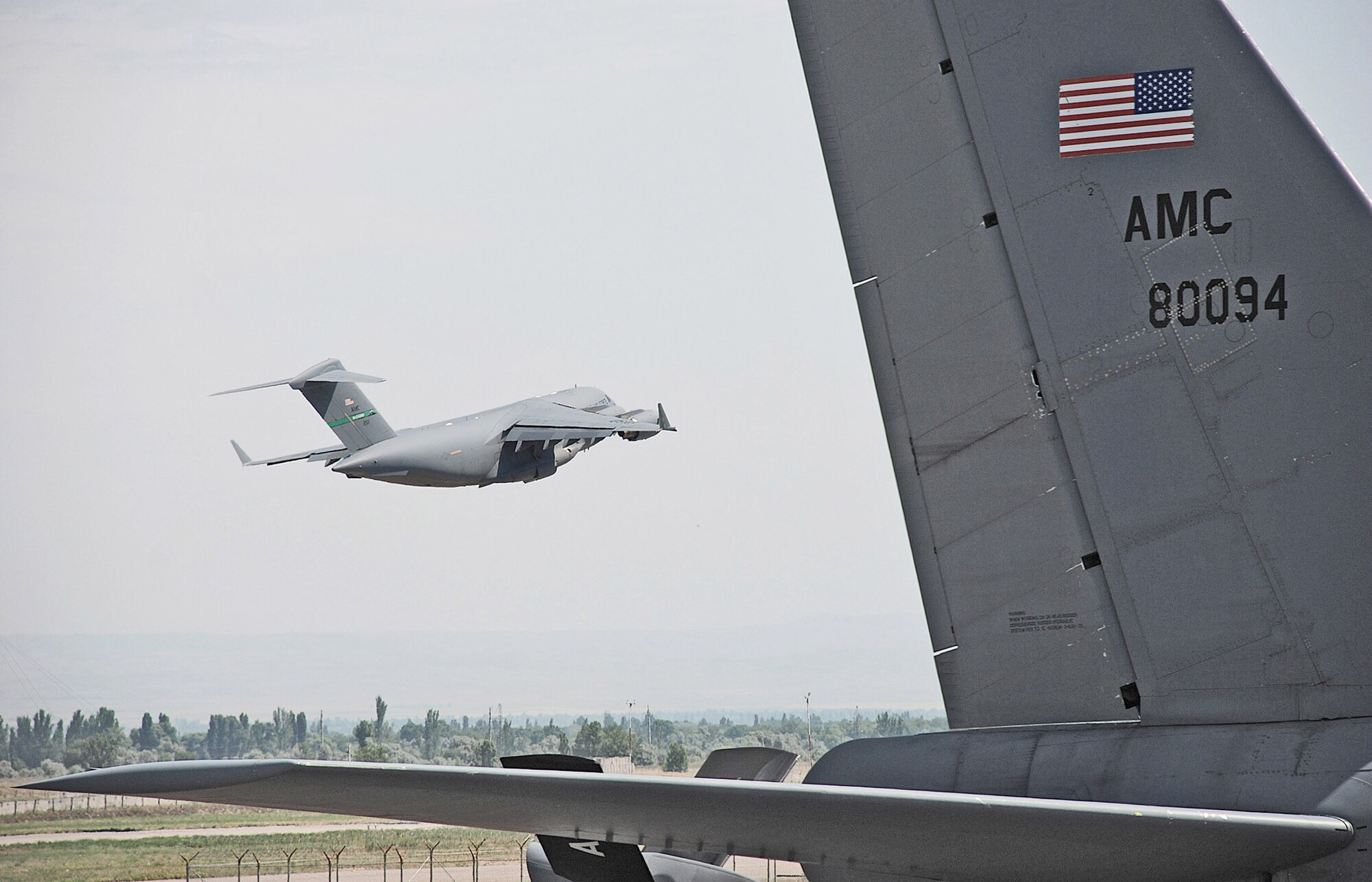 A C-17 Globemaster III takes off from Manas International Airport, Kyrgyz Republic, for a mission.  Coalition C-17s and C-130 Hercules aircraft flew 155 airlift sorties Aug. 22 and delivered more than 565 tons of cargo. The mobility aircraft also moved more than 4,000 passengers throughout the area of responsibility.  (U.S. Air Force photo/Staff Sgt. Les Waters) 