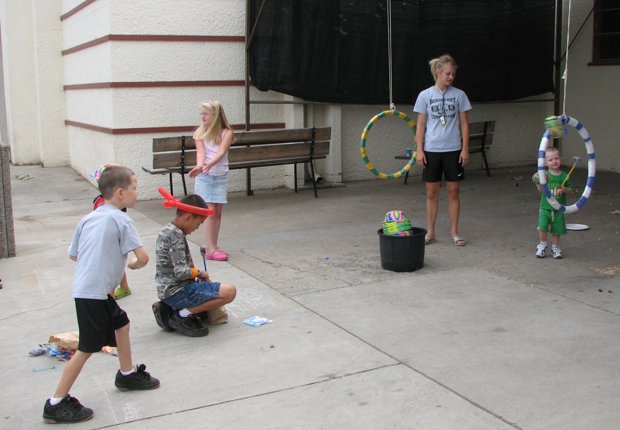Children participate in a football-toss to win a multi-colored day-glow hat at the annual Military Affairs Committee Military Appreciation Picnic at the Montana ExpoPark Aug. 18. The committee hosts the picnic to thank the active duty, reserve and National Guard servicemembers for their service. The event includes free food, door prizes and activities for children ranging from arts and crafts to padded baton jousts. (U.S. Air Force photo by Airman 1st Class Dillon White)