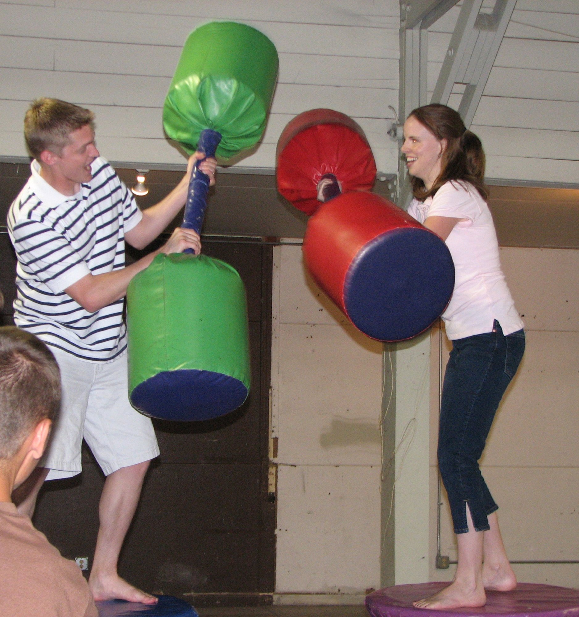 Second Lieutenant Korry Leverett and his wife Brittany, square-off in the padded-baton joust at the annual Military Affairs Committee Military Appreciation Picnic at the Montana ExpoPark Aug. 18. The committee hosts the picnic to thank the active duty, reserve and National Guard servicemembers for their service. The event includes free food, door prizes and activities for children. (U.S. Air Force photo by Airman 1st Class Dillon White)