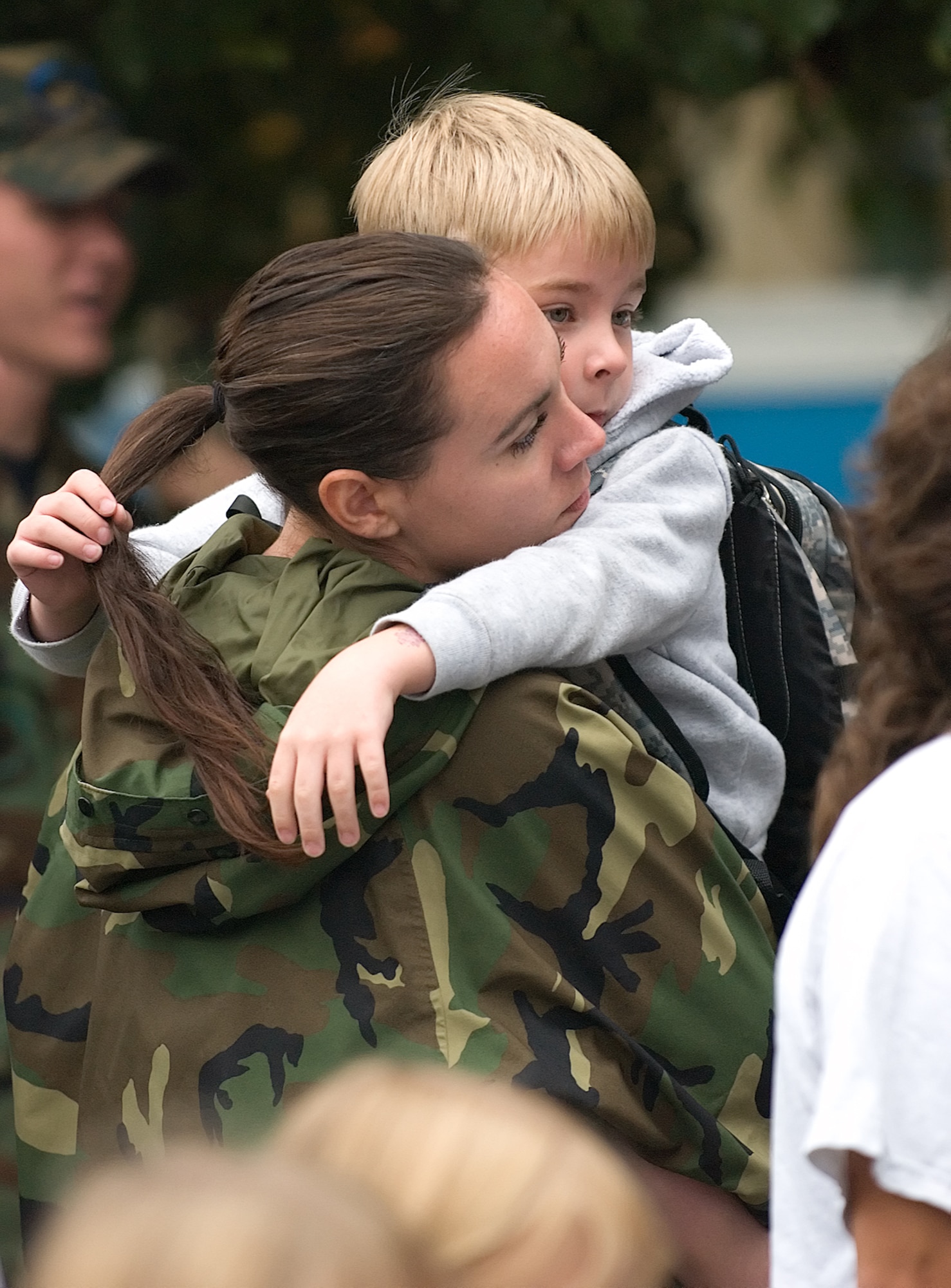 Jaime Davis, wife of Staff Sgt. Philip Stewart, 512th Security Forces Squadron, hugs her son, Aiden, as she sends him off to his first day of school at Welch Elementary School Wednesday.  The six-year old started first grade this year. (U.S. Air Force photo/Jason Minto)