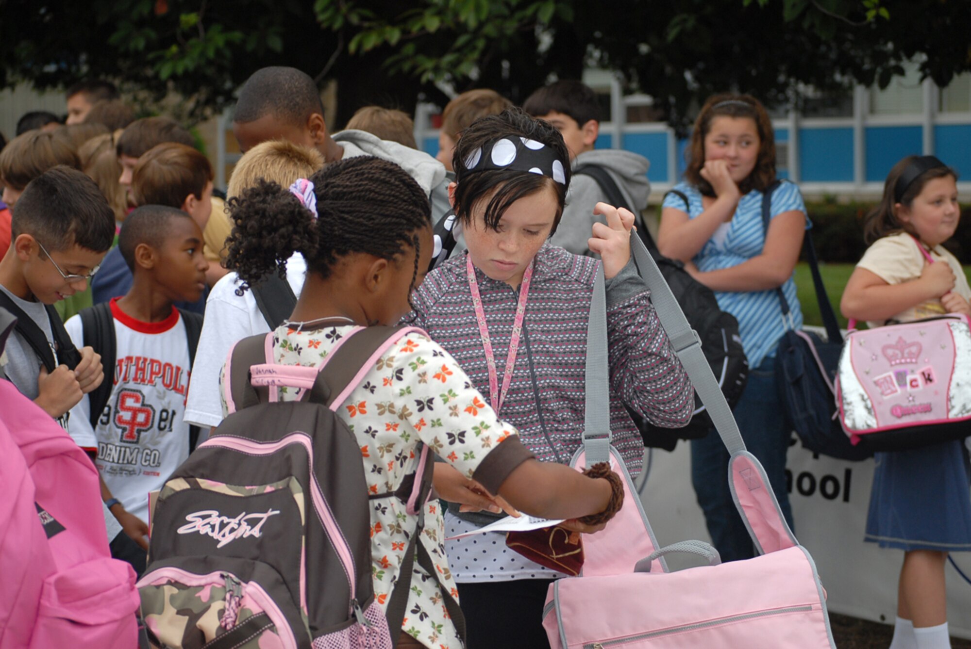 Dover Air Force Base Middle School children gathered outside school Wednesday. It was the first day of school and the children checked each others’ class rosters to see what classes their friends had and what classes they had together. (U.S. Air Force photo/Tech. Sgt. Kevin Wallace)