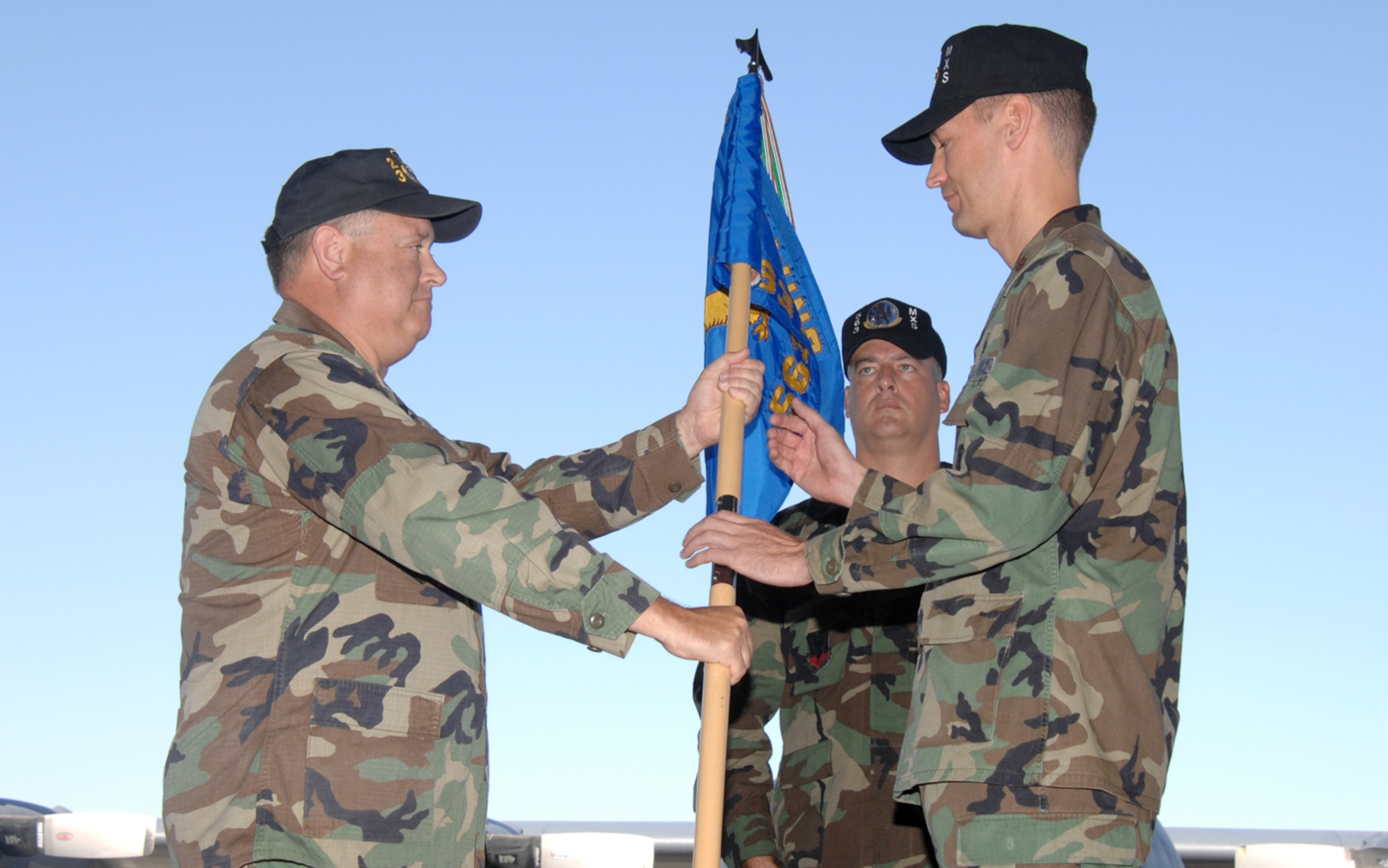 Maj. Allan M. Hodge (right) receives the 563rd Maintenance Squadron guidon from Col. Bryan P. Glynn, 23rd Maintenance Group commander, during a change-of-command ceremony on the flight line here Aug. 10. Major Hodge assumed command of the 563rd MXS from Maj. John S. Bulldis, who retired from active duty. (U.S. Air Force photo/Tech. Sgt. Matthew Lohr)