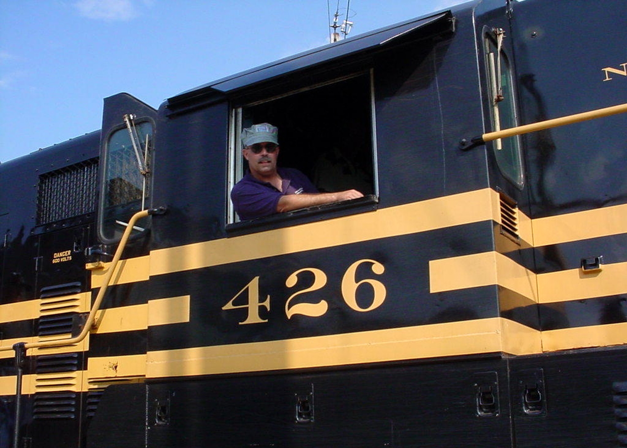 GRISSOM AIR RESERVE BASE, Ind., -- Master Sgt. Les McConnell, 434th Air Refueling Wing historian,  sits behind the controls of the 'Fairtrain' at the Indiana State Fair. Sergeant McConnell has been an engineer with the State Fair since 1992. During the State Fair, the train is operated daily by 25 volunteers.  The Fairtrain makes 10 round trips every day operating 11 vintage railroad cars and locomotives. The train eases traffic parking at the state fair.  (U.S. Air Force photo)