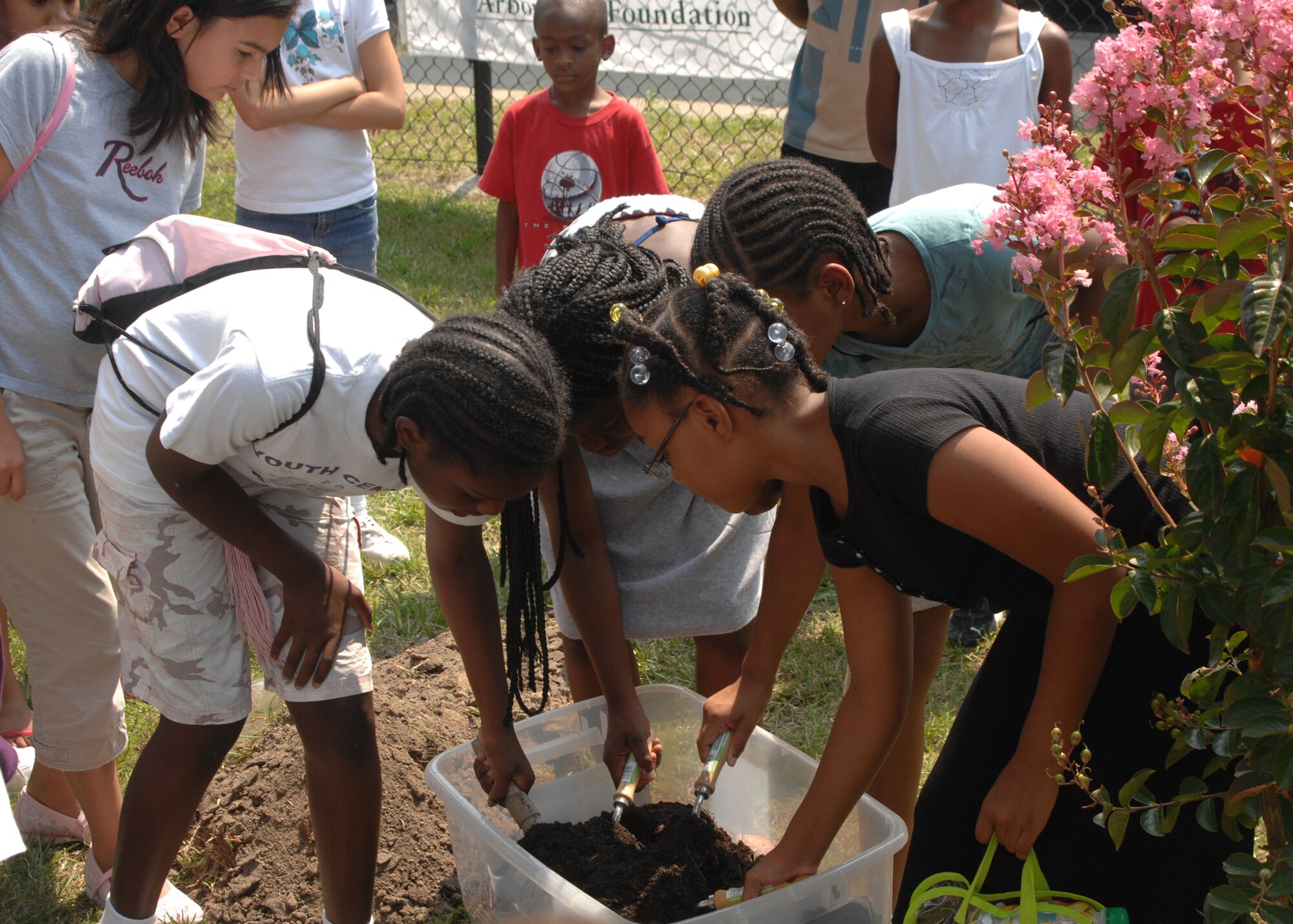 SEYMOUR JOHNSON AIR FORCE BASE, N.C. - Jalesia Claxton, Daijha Spain, Monica Mack, and Tiaesha Morgan,(from left to right) participants in the summer long Environmental Summer Club held weekly at the Youth Center on August 15. 4 Civil Engineering Squadron Environmental Management Flight partnered with the Wayne County Recycling Coordinator and the 4 Services Squadron Youth Center to develop and lead a Summer Environmental Club for 9- to 12-year-old base youth.(US Air Force photo by Airman First Class Ciara Wymbs)