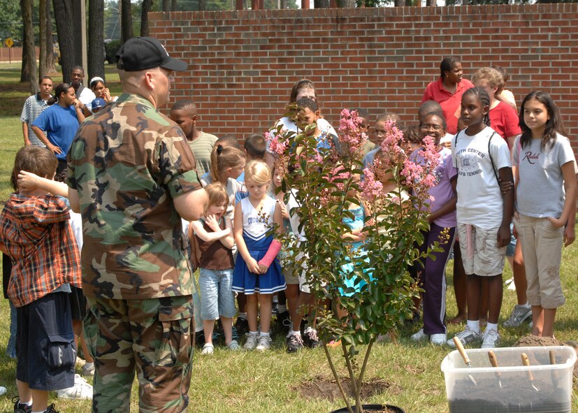 SEYMOUR JOHNSON AIR FORCE BASE, N.C. - Lieutenant Colonel Anthony Higdon, 4th Civil Engineering Squadron commander, speaks to youth center environmentalists about the importance of planting trees and taking care of them August 15. The tree planting is part of Arbor day held on base.(U.S. Air Force photo by Airman 1stClass Ciara Wymbs) 