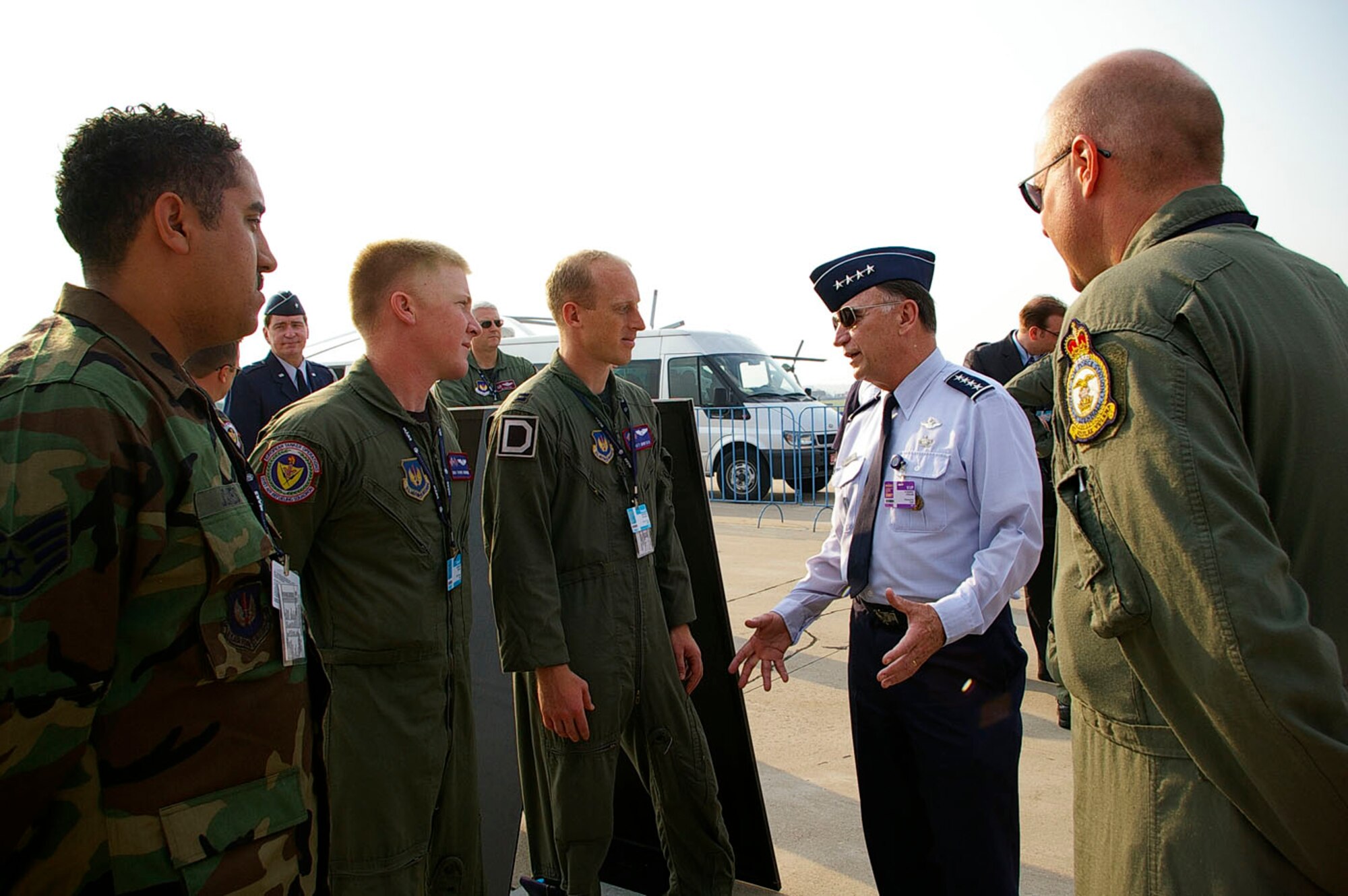 RAMENSKOYE AIRFIELD, Zhukovsky, Russia -- Gen. Tom Hobbins, U.S. Air Forces in Europe commander, takes a moment to chat with Staff Sgt. Kevin Jones, Senior Airman Travis Swinson, Capt. Scott Montier and Senior Master Sgt. Todd Cole from the 100th Air Refueling Wing, Royal Air Force Mildenhall, England, Aug. 21 during the first day of the Moscow International Air Show. U.S. Air Force aircraft from Europe and the states are part of the static display and flying demonstration at the air show near Moscow. General Hobbins visited the air show and met with some of his troops from USAFE. While here, he also met with Russian President Vladimir Putin and chief of staff of the Russian Federation air force, Gen.-Col. Alexsandr Zelin. The air show is one of the premier events of its type in the world. U.S. participation in the air show demonstrates our commitment to international security, promotes international cooperation and contributes to U.S. foreign policy objectives. About 65 airmen from bases in Europe and the states are participating in this year’s air show. U.S. Air Force photo by Karen Abeyasekere