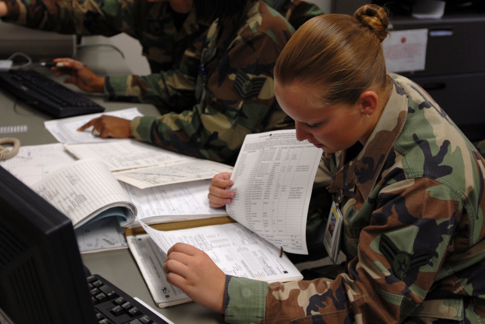 Airman 1st Class Christina Johnson, 18th Aerospace Medicine Squadron, reviews medical records of those preparing to deploy during Kadena's Local Operational Readiness Exercise.
(U.S. Air Force photo/Airman 1st Class Kasey Zickmund)