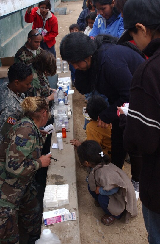Patients line up as members of Joint Task Force-Bravo's medical humanitarian relief task force hand out the perscribed medicines. The team saw more than 1,500 patients in three days, diagnosing a variety of ailments such as gasto-intestinal illness, respitory infections and minor aches and pains. 