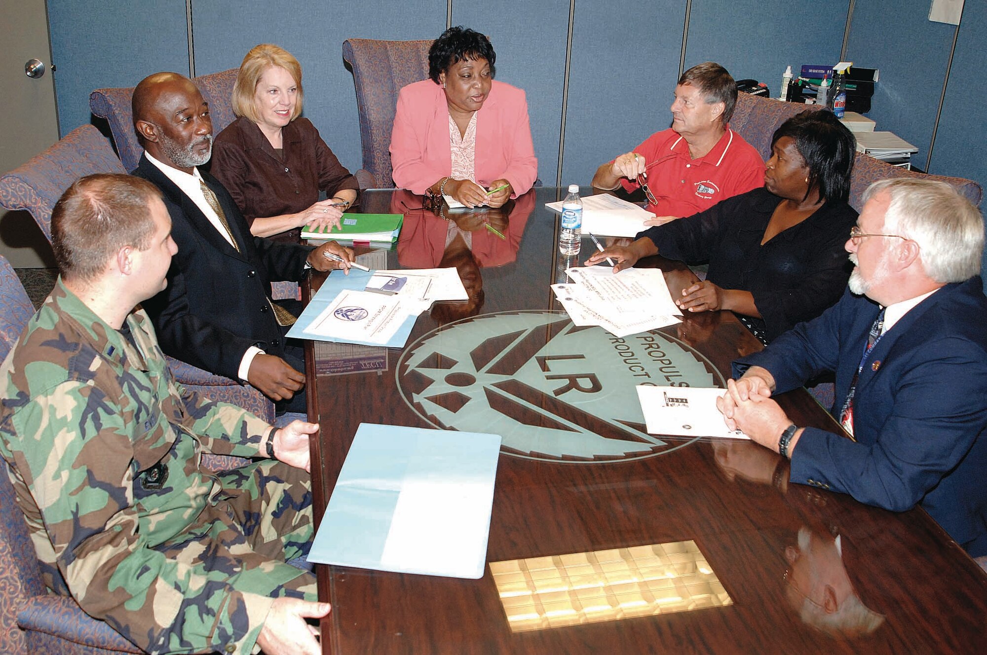 Members of the Director of Propulsion discuss the engine needs of their customers who are in all major commands.  Clockwise from left are; 1st Lt.  Jeremy Evert, Michael Thomas, Janice Eberhard, Georgia Washington, Bob Bondaruk, Vanessa Barkus, and Mickey Conklin. (Air Force photo by Kelly Sharp)