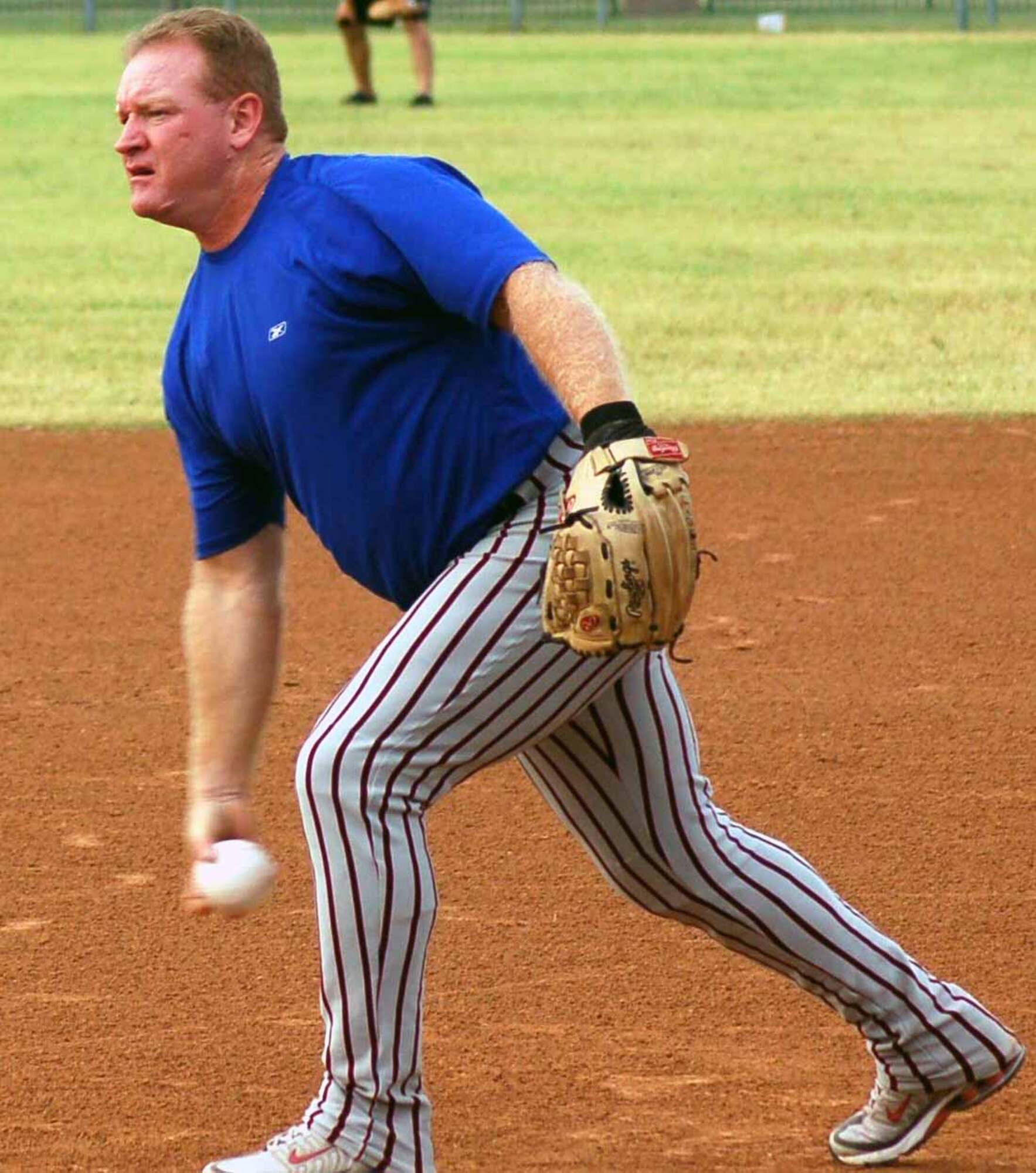Pitcher Mark Upchurch, 552nd Maintenance Squadron, delivers a pitch in the first inning during the 2007 base championship against the 34th Combat Communications Squadron Aug. 17. The 552nd MXS won the game 19-9. (Air Force photo by John E. Banks)