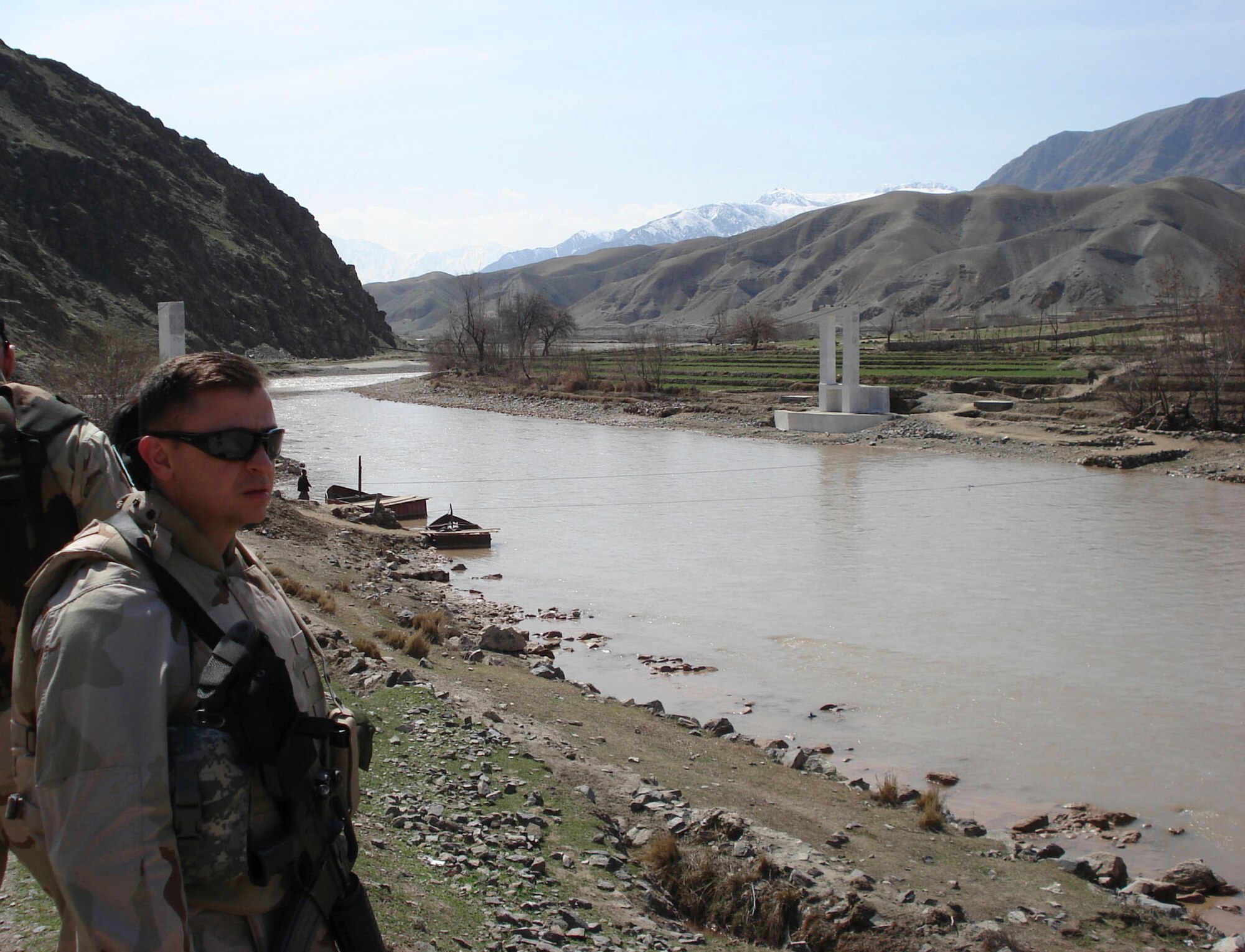 Maj. Homer Nesmith, a T-6 instructor pilot from Vance Air Force Base's 5th Flying Training Squadron, surveys the initial construction of a bridge in Afghanistan. Major Nesmith returned to Vance from a six-month deployment this month to northern Afghanistan, where he served as a political regional adviser to the Regional Command North, in the political office for the International Security Assistance Force. (Courtesy photo)