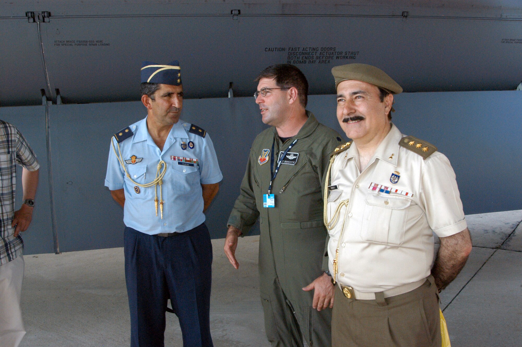 Spanish Lt. Col. Vicente Hueso Garcia (left) and Spanish Col. Manuel Morato Ferro talk with Lt. Col. Jeff Marcotte about the B-52 Stratofortress Aug. 22 during the Moscow International Air Show at Ramenskoye Airfield in Zhukovsky, Russia,. The Spanish officers are Spanish attaches to Russia, and Colonel Marcotte is from the 2nd Bomb Wing at Barksdale Air Force Base, La. (U.S. Air Force photo/Maj. Pamela A.Q. Cook)