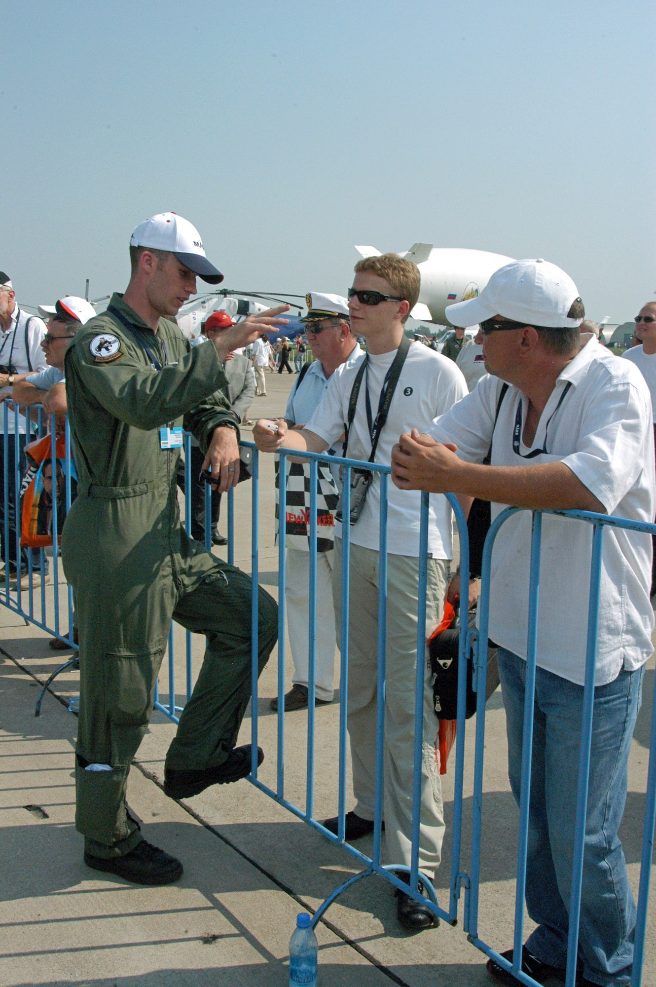 First Lt. Mike Middents talks with visitors Aug. 22 during the Moscow International Air Show at Ramenskoye Airfield in Zhukovsky, Russia. The air show runs through Aug. 26. Lieutenant Middents is assigned to the 2nd Bomb Wing at Barksdale Air Force Base, La. (U.S. Air Force photo/Maj. Pamela A.Q. Cook)