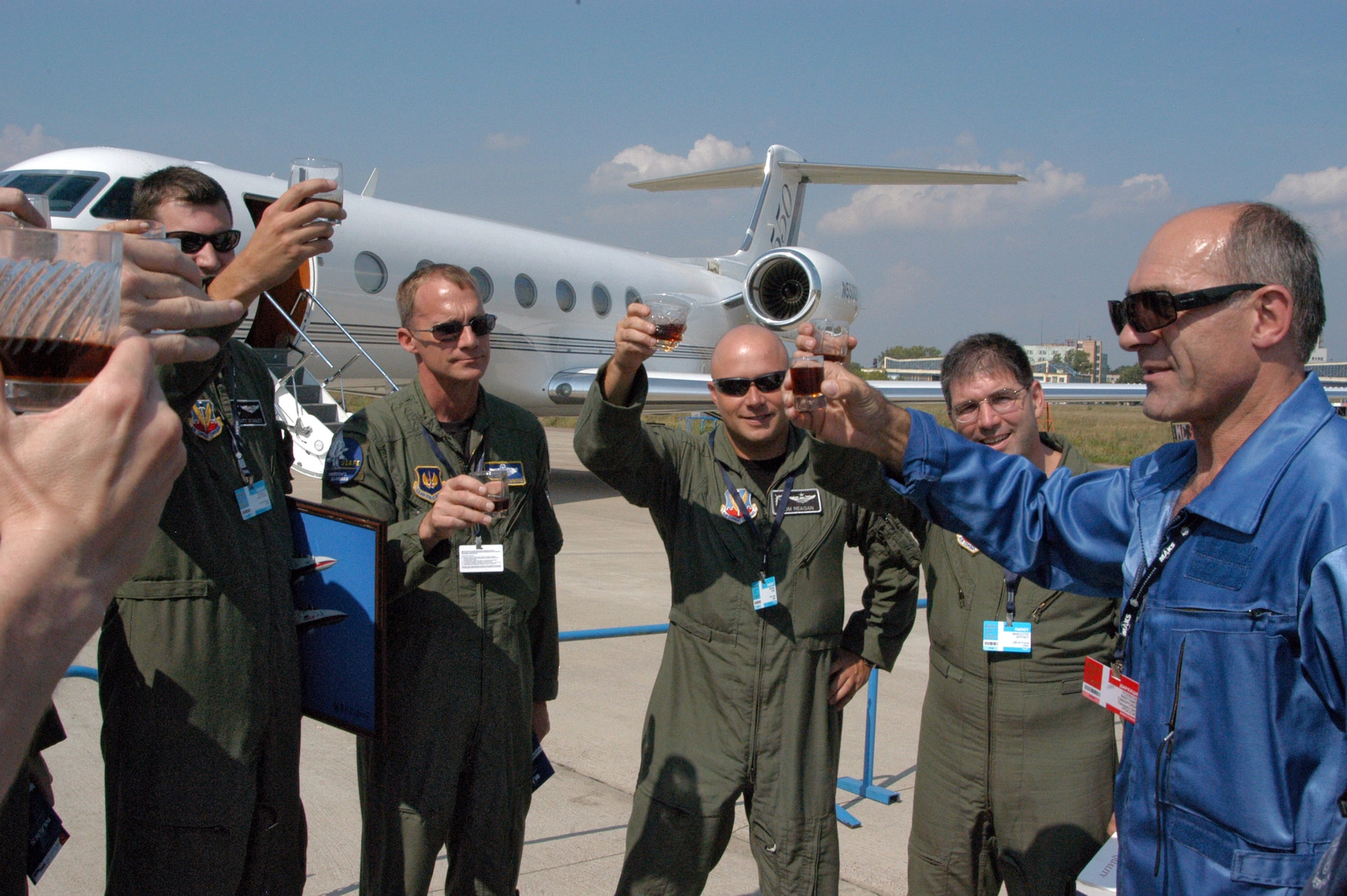 Capt. Matt Stanley, Col. Stephen Brummond, Maj. Tom Reagan and Lt. Col. Jeff Marcotte make a toast with retired Russian Gen.-Lt. Magomed Tolboyev upon the Air Force crew's arrival Aug. 18 at Ramenskoye Airfield in Zhukovsky, Russia. About 65 Airmen from bases in Europe and the states are participating in the Moscow International Air Show, which runs Aug. 21 to 26. Colonel Brummond is assigned to Ramstein Air Base, Germany, and the other Airmen are from Barksdale Air Force Base, La. (U.S. Air Force photo/Maj. Pamela A.Q. Cook)