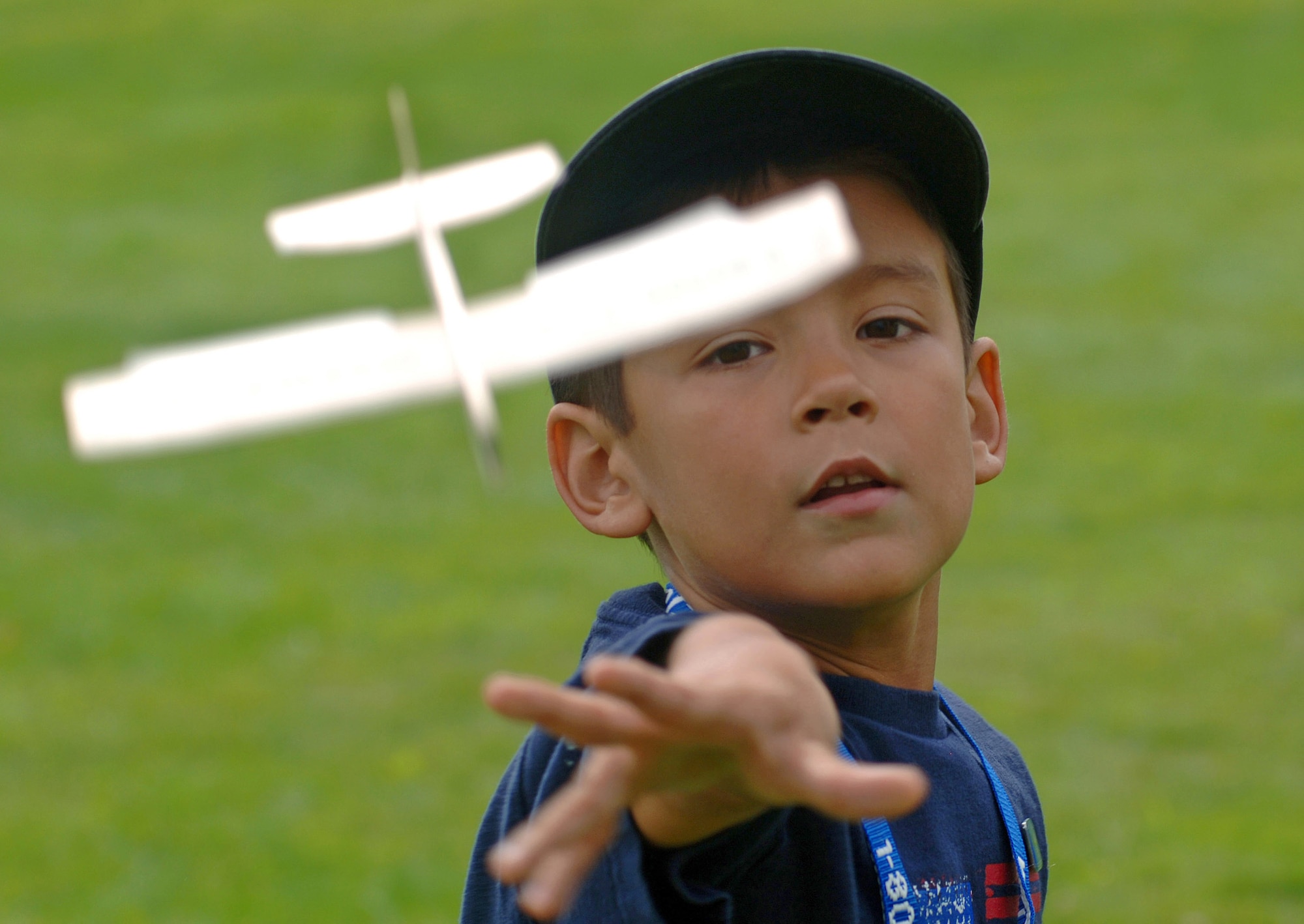 Thomas Fougery, 6, from Londonderry, N.H., tosses his balsa wood aircraft for it's first flight after completing an airplane building station as part of Air Force Week New England's Science Day Aug. 21at Concord, N.H. The Christa McAuliffe Planetarium hosted the Air Force New England Science Day, which provided children and adults hands on displays of Air Force equipment, a model rocket launch demonstration, an F-16 Fighting Falcon static display, and "Do Something Amazing" display trailers. (U.S. Air Force photo/Staff Sgt. Bennie J. Davis III) 
