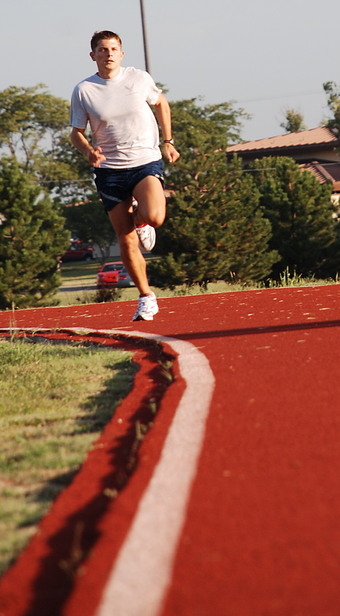 Second Lt. Anthony D’Amato, 22nd Communications, Squadron sprints down the base track Aug 23. He is training to compete at the 11th annual Air Force Marathon at Wright Patterson Air Force Base, Ohio, Sept. 15. (photo by Airman 1st Class Jessica Lockoski)