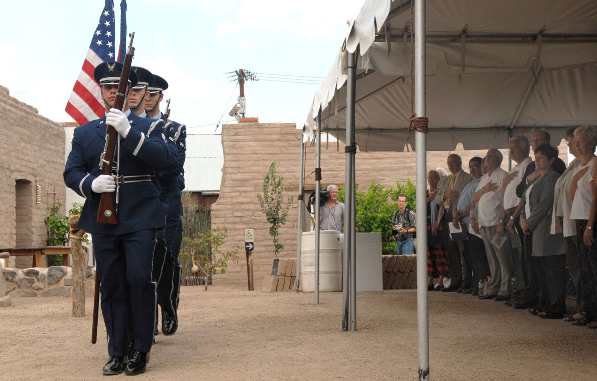 The Davis-Monthan Air Force Base Honor Guard presents the American flag while the Pledge of Allegiance is recited by members of the crowd Aug. 20 during a flag ceremony in celebration of Tucson's 232nd birthday at the Presidio San Agustin del Tucson courtyard. The city of Tucson celebrates its birthday each year with a variety of festivities held throughout the month of Aug.  (U.S. Air Force photo/Airman 1st Class Alesia Goosic)