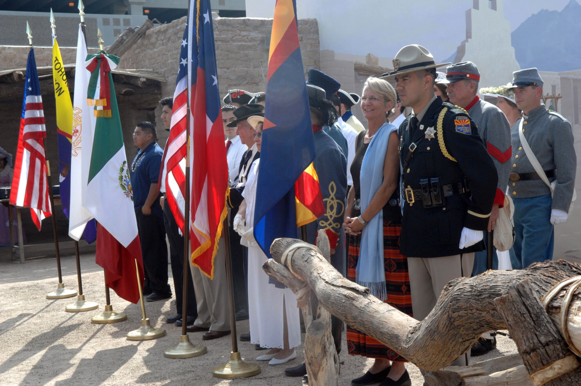 Tucson citizens in period costumes present the the five flags that have flown over the city throughout its history – including those of the modern U.S., the Confederate States of America, Spain, Mexico, the state of Arizona – during a ceremony  celebrating Tucson's 232nd birthday Aug. 20 at the Presidio San Agustin el Tucson courtyard. (U.S. Air Force photo/Airman 1st Class Alesia D. Goosic) 