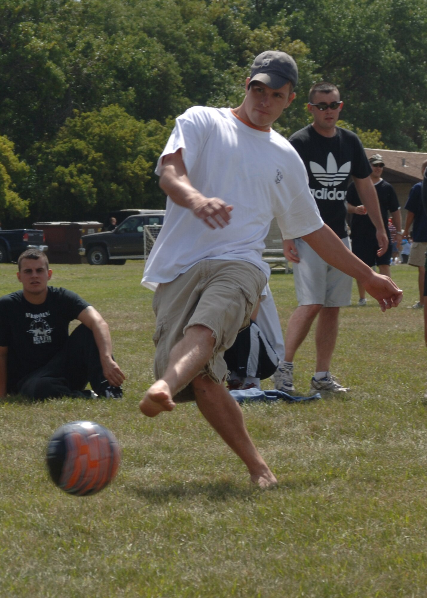 Airman 1st Class Paul Adams, 319th Operation Support Squadron, kicks a worm burner while competing in the soccer kick contest during the 2007 Summer Bash. (USAF Photo/Staff Sgt Suellyn Nuckolls)