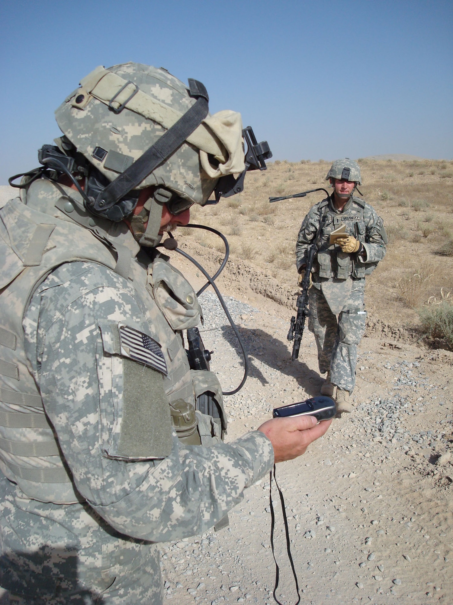 1st Lt. Travis Vazansky, right, deployed from the 341st Civil Engineer Squadron at Malmstrom Air Force Base, Mont., helps mark waypoints on a GPS during a road assessment with Master Sgt. Paul McIndoe, left, Aug. 18. Both Airmen are assigned to Provincial Reconstruction Team Qalat, Afghanistan. PRT Qalat is a joint U.S. Air Force and Army team assigned to the country’s volatile southeast province of Zabul. As part of NATO’s International Security Assistance Force, PRT Qalat conducts civil-military operations designed to extend the reach and legitimacy of the Islamic Republic of Afghanistan by promoting good governance and justice; enabling an active and effective Afghan security force; and facilitating reconstruction, development and economic growth. Sergeant McIndoe is deployed from the 690th Alterations and Installation Squadron at Lackland Air Force Base, Texas. (U.S. Air Force photo/Capt. Bob Everdeen).