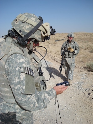 1st Lt. Travis Vazansky, right, deployed from the 341st Civil Engineer Squadron at Malmstrom Air Force Base, Mont., helps mark waypoints on a GPS during a road assessment with Master Sgt. Paul McIndoe, left, Aug. 18. Both Airmen are assigned to Provincial Reconstruction Team Qalat, Afghanistan. PRT Qalat is a joint U.S. Air Force and Army team assigned to the country’s volatile southeast province of Zabul. As part of NATO’s International Security Assistance Force, PRT Qalat conducts civil-military operations designed to extend the reach and legitimacy of the Islamic Republic of Afghanistan by promoting good governance and justice; enabling an active and effective Afghan security force; and facilitating reconstruction, development and economic growth. Sergeant McIndoe is deployed from the 690th Alterations and Installation Squadron at Lackland Air Force Base, Texas. (U.S. Air Force photo/Capt. Bob Everdeen).