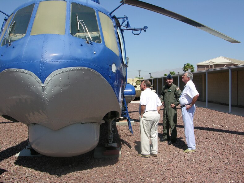 NELLIS AIR FORCE BASE, Nev. -- Col. Fritz Linsenmeyer, commander of the 916th Air Refueling Wing, stands with two Goldsboro community leaders at Nellis Air Force Base's 'petting zoo.'  More than 30 members of Seymour Johnson Air Force Base's Military Affairs Committee were able to travel with the Air Force Reserve Wing as a part of a joint civic leader tour with their active duty counterparts, the 4th Fighter Wing. The 'petting zoo' offers a collage of enemy weaponary for educational purposes.