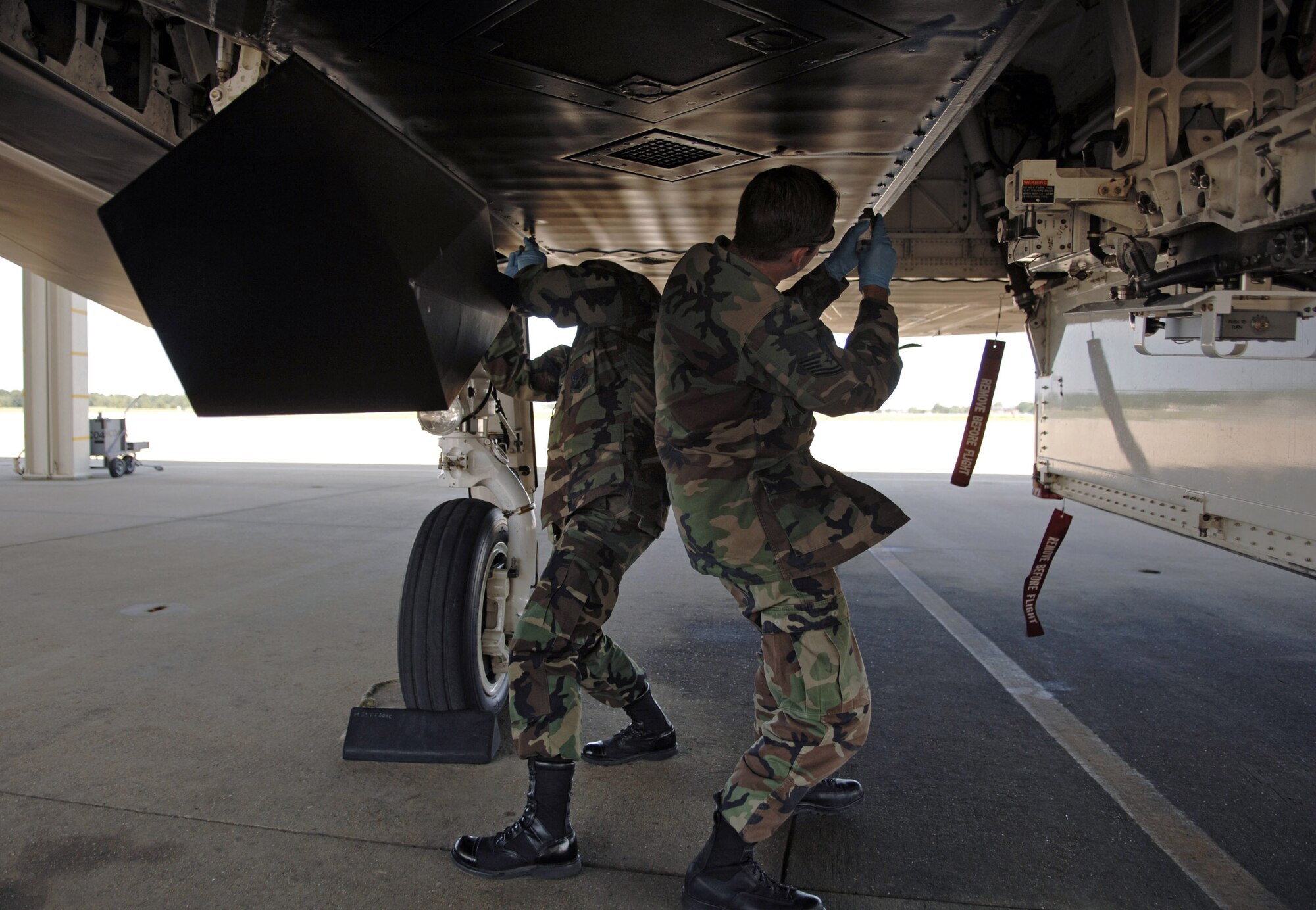 Staff Sgt. Anthony Hyland (left) and Tech. Sgt. Eric Brennon check over an F-117 Nighthawk Aug. 14 during preflight maintenance at Langley Air Force Base, Va.  (U.S. Air Force photo/Staff Sgt. Eric T. Sheler)
