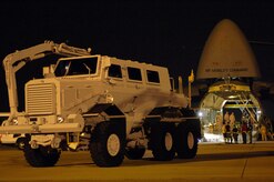 Airmen prepare to load a mine-resistant ambush-protected vehicle into a C-5 Galaxy at Charleston Air Force Base, S.C., Aug. 16 for shipment to Iraq.  (DOD photo/Staff Sgt. Jason Robertson)