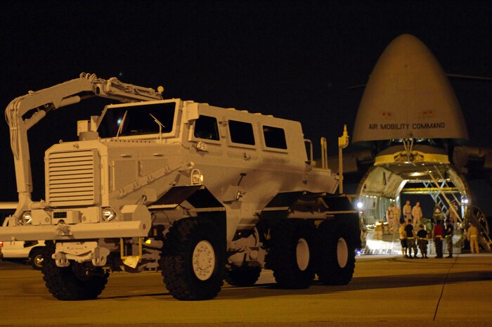 Airmen prepare to load a mine-resistant ambush-protected vehicle into a C-5 Galaxy at Charleston Air Force Base, S.C., Aug. 16 for shipment to Iraq.  (DOD photo/Staff Sgt. Jason Robertson)