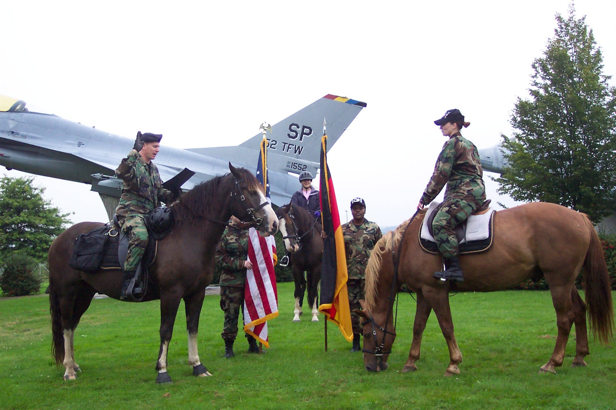 SPANGDAHLEM AIR BASE, Germany – Maj. Paul Cairney, 52nd Security Forces Squadron commander, reenlists Staff Sgt. Chrissy Hattery, 52nd Component Maintenance Squadron, at the Spangdahlem AB air park as they both sit on their horses, Aug. 21. This is Sergeant Hattery’s second reenlistment.   (Courtesy photo)