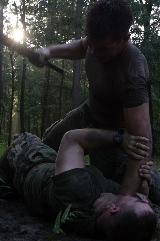 A Marine attacks another Marine with a baton during Marine Special Operations Advisor Group?s 12-day light-infantry tactics training package at Mike Bravo training area here, from Aug. 20 until Friday. The training is part of U.S. Marine Corps Forces, Special Operations Command?s continuous preparation for Foreign Internal Defense missions. Forty Marines with MSOAG?s six-month student pipeline conducted day and night raid operations, combat patrols, ambushes, assaults and a combination of movement and live-fire exercises. They also learned various knife and baton combat techniques to help them in close-combat situations.