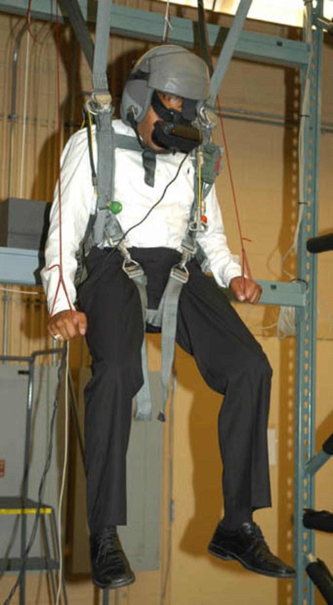 GRISSOM AIR RESERVE BASE, Ind -- Mr. Hodge Patel, district director for Congressman Joe Donnelly, tries his skills on the Aircrew Emergency Parachute Flight Simulator during a recent tour of the base.  Mr. Patel, along with six other congressional staffers, took part in Grissom's Quarterly Congressional Outreach hosted by Brig. Gen. Dean Despinoy, 434th Air Refueling Wing Commander.  The parachute simulator is used by Life Support personnel to train aircrew members in survival tactics.  (U.S. Air Force photo/Lt. Col. Gary Lockard)