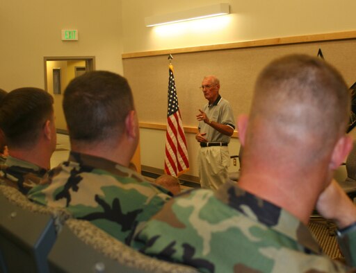 Retired Chief Master Sergeant of the Air Force James McCoy, speaks to Team Whiteman's newly selected senior NCOs at the professional development center prior to the SNCO induction ceremony Aug. 24. Chief McCoy, who was guest speaker of the ceremony, entered the Air Force in 1951 and served with the Air Defense Command as a radar operator and instuctor. He was selected as one of the 12 Outstanding Airmen of the Air Force in 1974, and became the sixth chief master sergeant of the Air Force in Aug. 1979. (U.S. Air Force photo/Staff Sgt. Rob Hazelett)