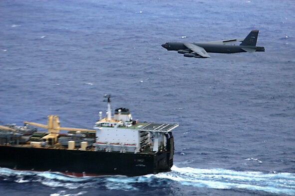A 2nd Bomb Wing B-52H Stratofortress flies over the UNSN 2nd Lt John P Bobo, a maritime pre-positioning ship, during a maritime intercept training mission, Aug 24. (U.S. Air Force photo/Lt. Col. Ricardo Beruvides)