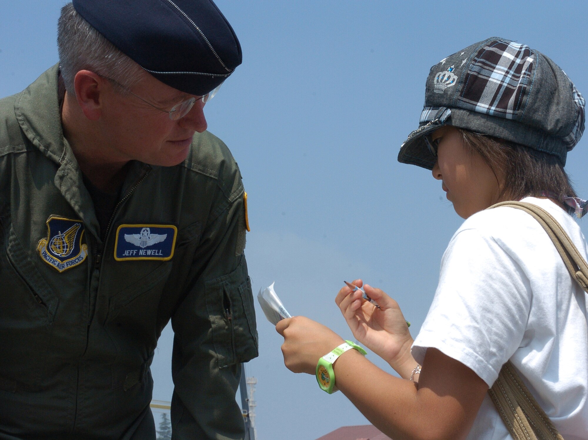 YOKOTA AIR BASE, Japan -- Col Jeff Newell, Commander of the 374th Air Wing answers questions for Japanese Students at the Friendship Festival that was held at Yokota Air Base on 25 August 07. The Friendship Festival is an event that allows Japanese Nationals to learn more about Yokota Air Base and the United States Military. (USAF Photo by Amn Leandra D. Hernandez) NOT RELEASED
