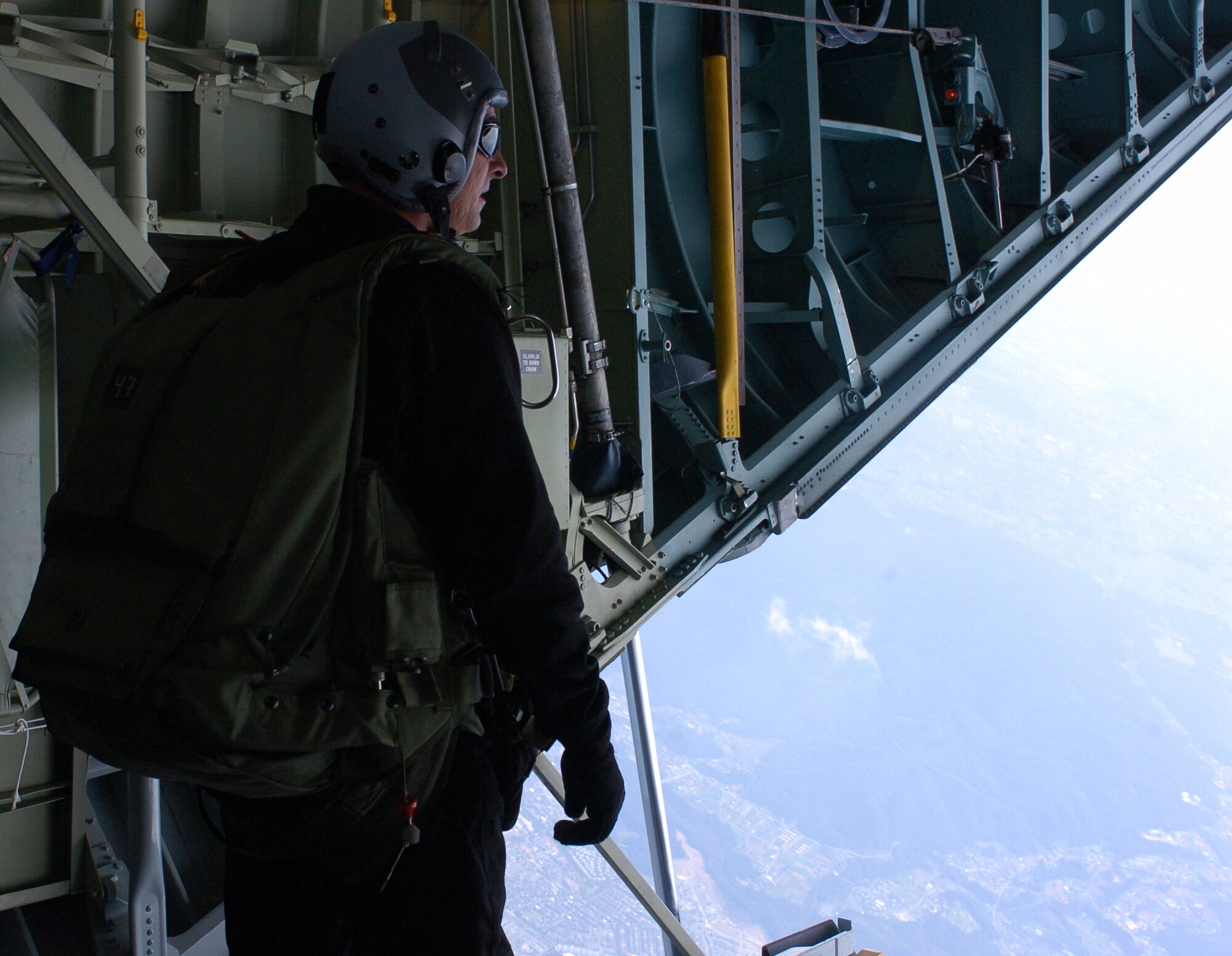 YOKOTA AIR BASE, Japan -- A member of the 31st Rescue Squadron From Kadena Air Base, Okinawa, Japan, prepares to participate in a High Altitude Low Opening jump as a part of a demonstration out of a C-130 Hercules flown by the 36th Airlift Squadron from Yokota AB for the Friendship Festival that was held at Yokota Air Base on 25 August 07. The Friendship Festival is an event that allows Japanese Nationals to learn more about Yokota Air Base and the United States Military. (USAF Photo by Amn Leandra D. Hernandez) NOT RELEASED

